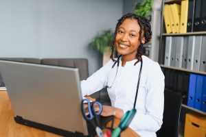 African female doctor make online telemedicine video call consult patient.